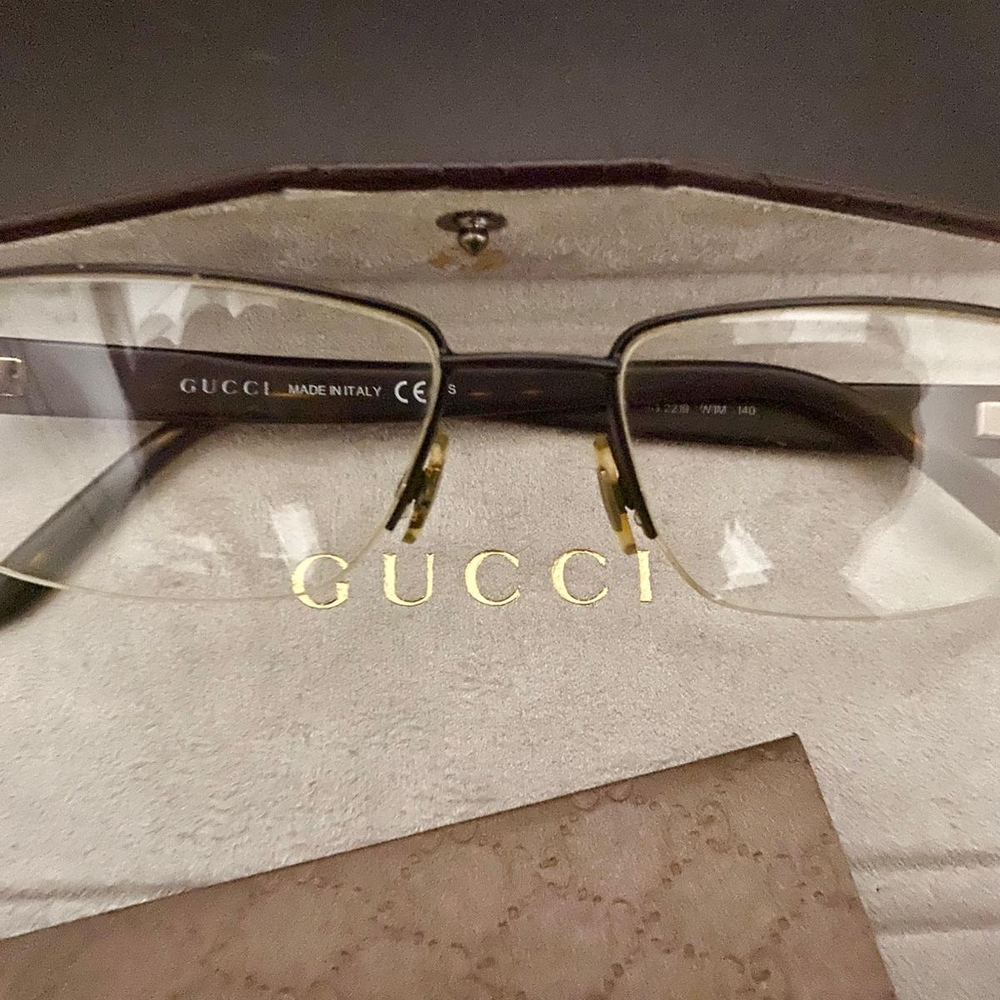Gucci Gold and Black Rimless Eyewear